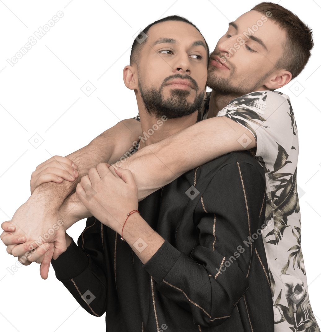 A man is hugging his boyfriend from behind