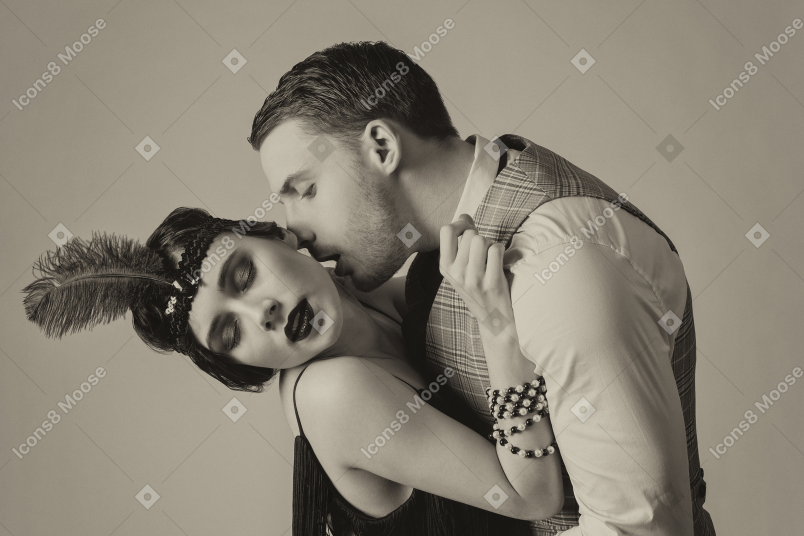 Portrait of passionate young man kissing a flapper