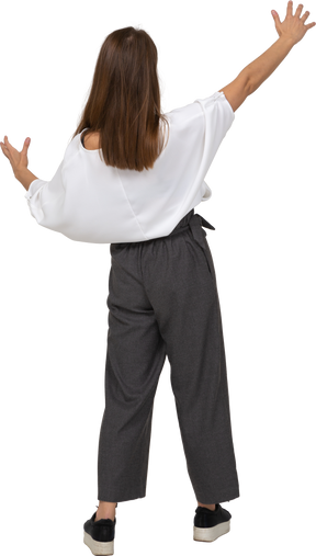 Back view of a young lady in office clothing showing a size of something