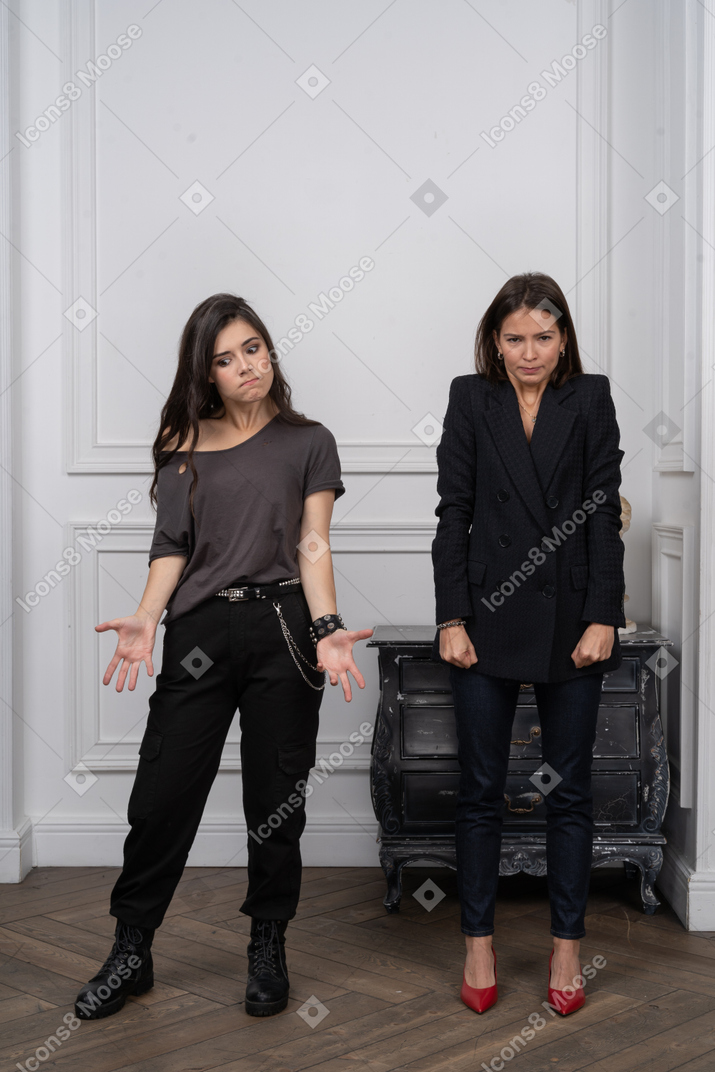 Two angry young women in the room