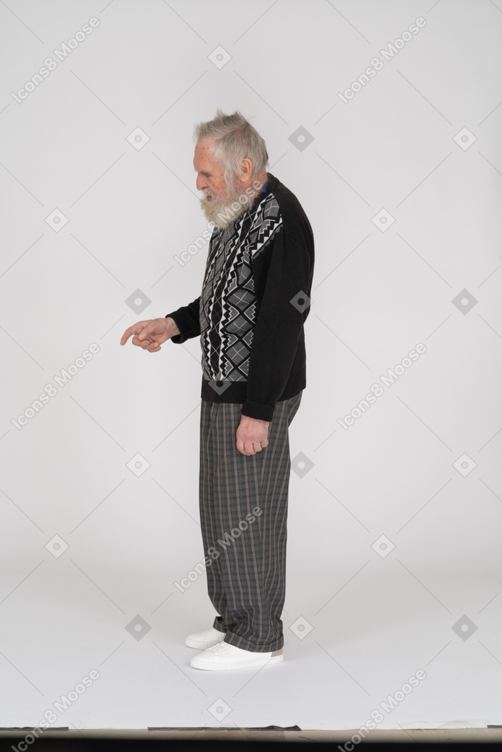Side view of scolding old man looking down