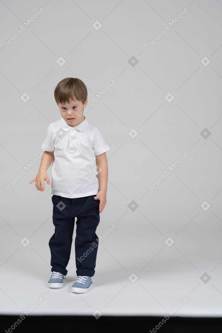 Front view of young boy looking at camera