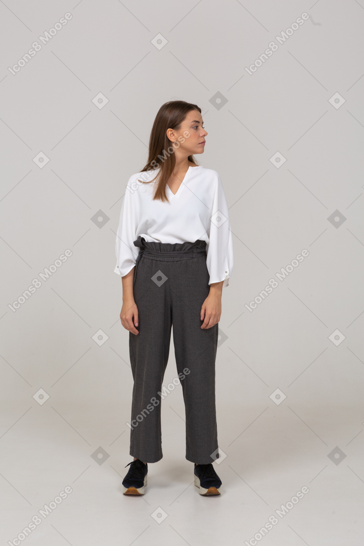 Front view of a young lady in office clothing looking to the right