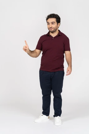 Smiling man showing one finger