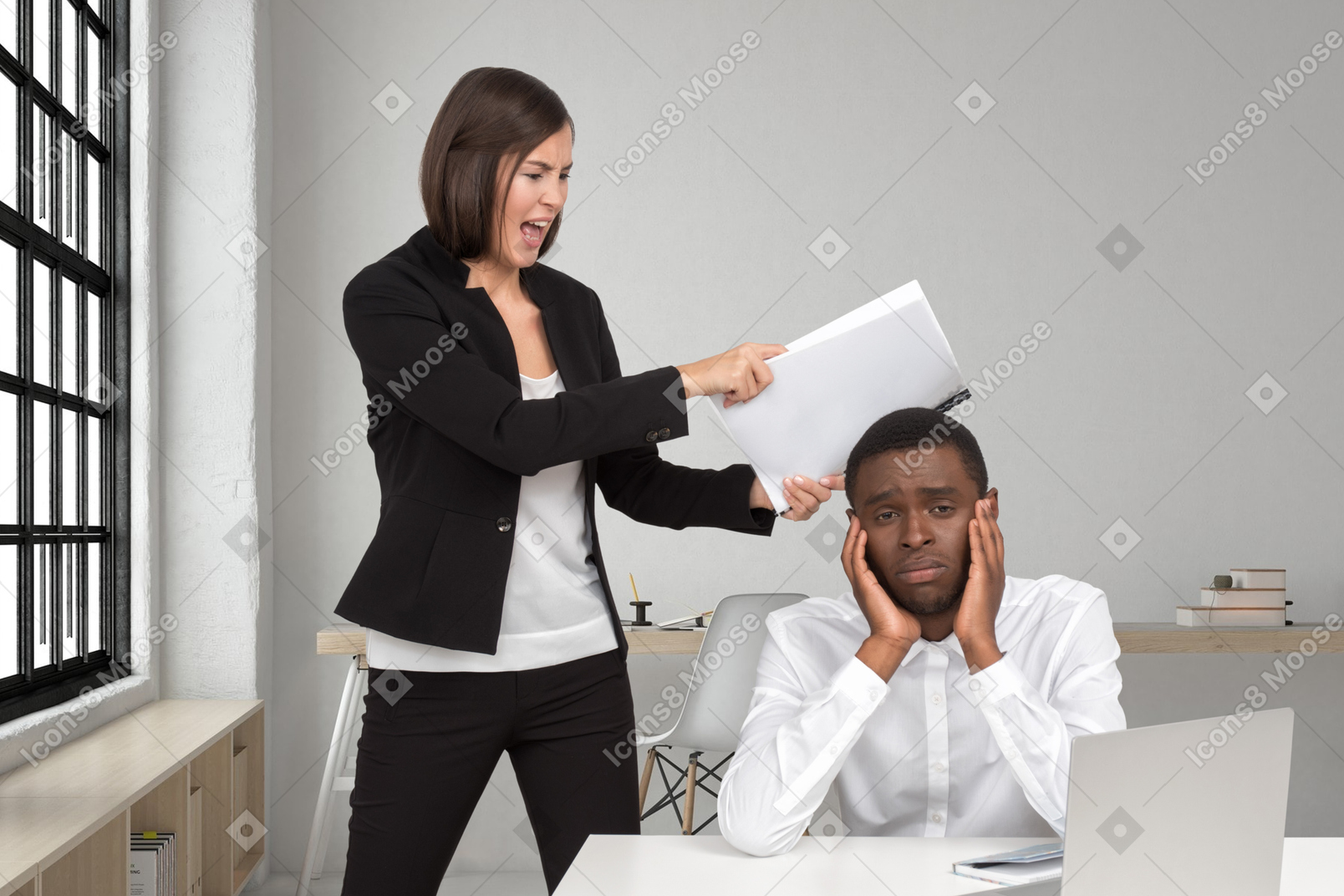 Female boss hitting employee at laptop