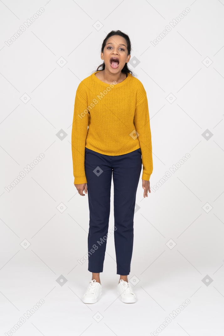 Front view of a girl in casual clothes shouting and looking at camera
