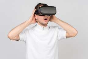 Amazed man in virtual reality headset