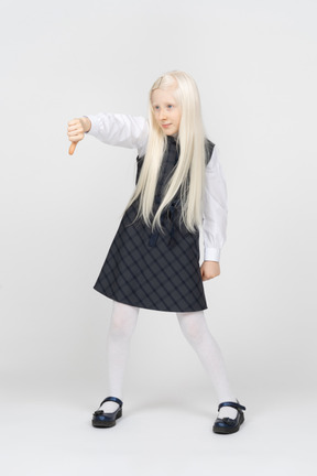 Schoolgirl with long hair showing thumbs down