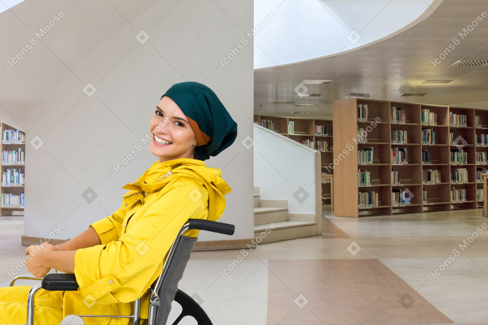 Disabled man in wheelchair in a library
