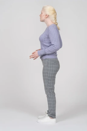 Side view of a young woman standing