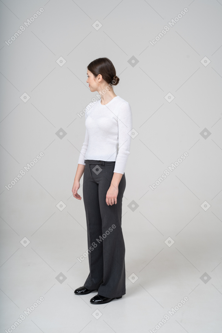 Front view of a woman in white blouse and black pants