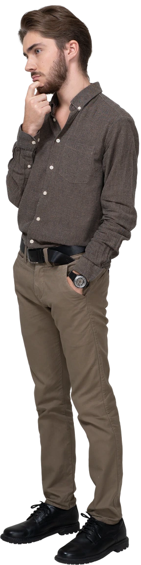 Three-quarter view of a thoughtful young man in office clothing touching chin