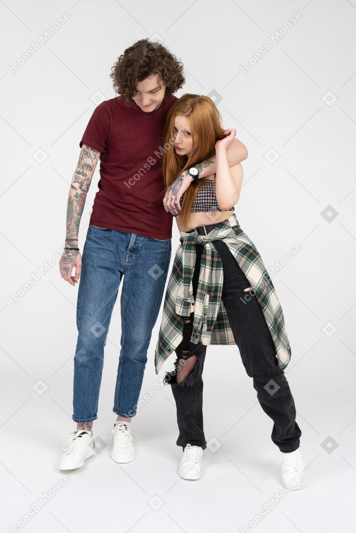 Teenage couple standing close together