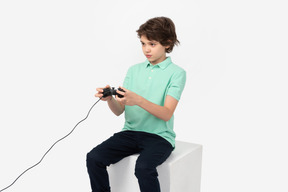 Focused teenager playing video games