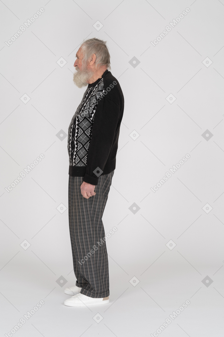 Side view of old man standing upright