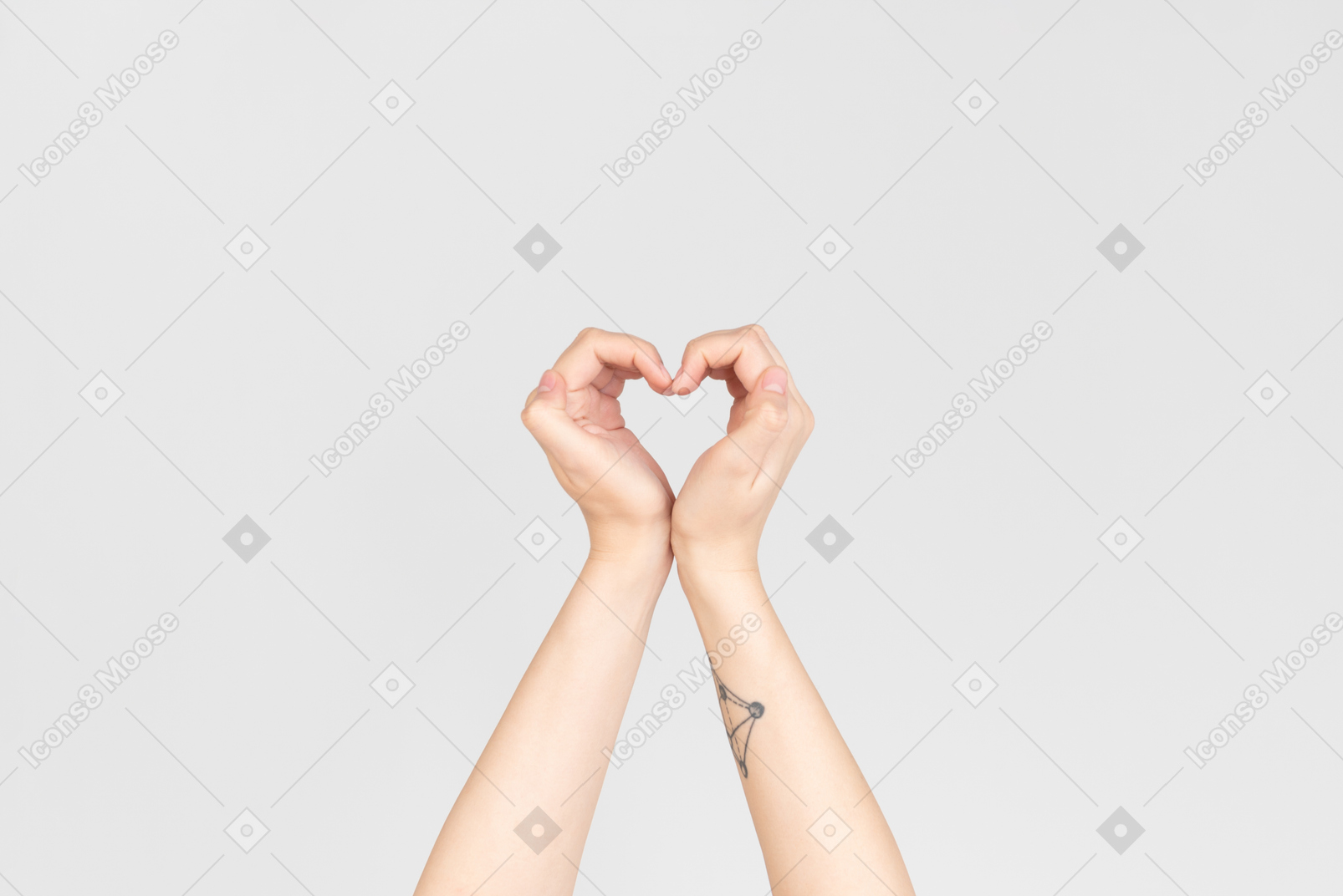 Female hands making a heart