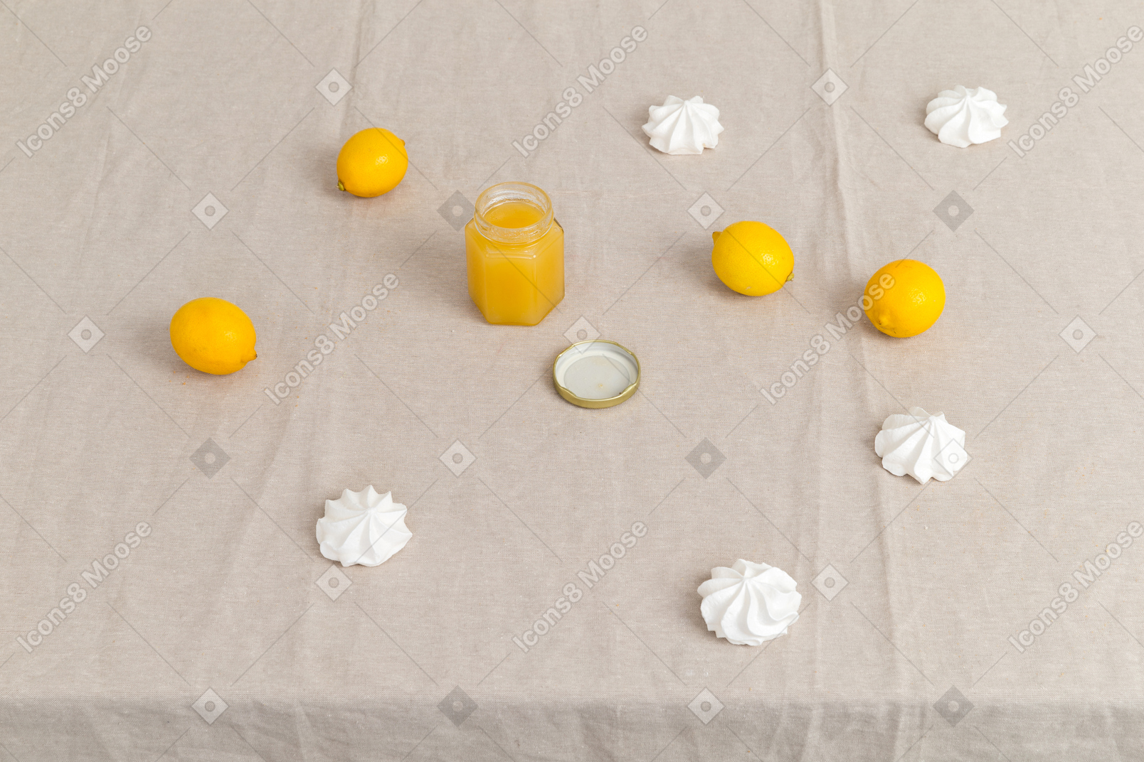 Lemons, marshmallows and jar of honey