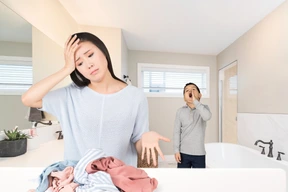 A tired looking woman standing in front of a pile of clothes with a boy shouting on a background