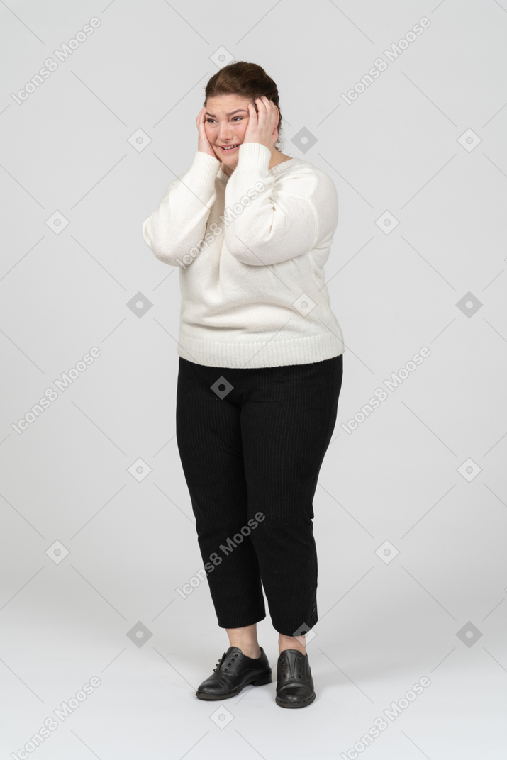Plump woman suffering from a terrible headache