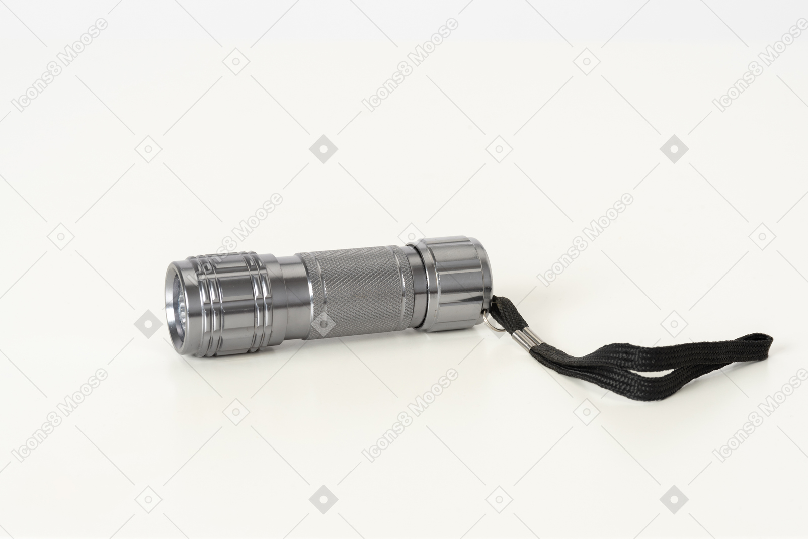 Silver flashlight on a white background