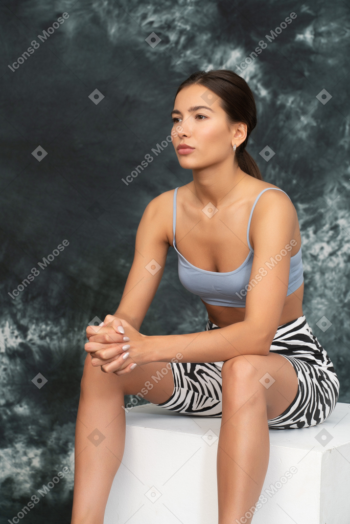 Female athlete sitting confidently with wrist-lock grip