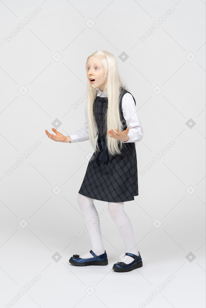 Schoolgirl looking very surprised with her mouth open