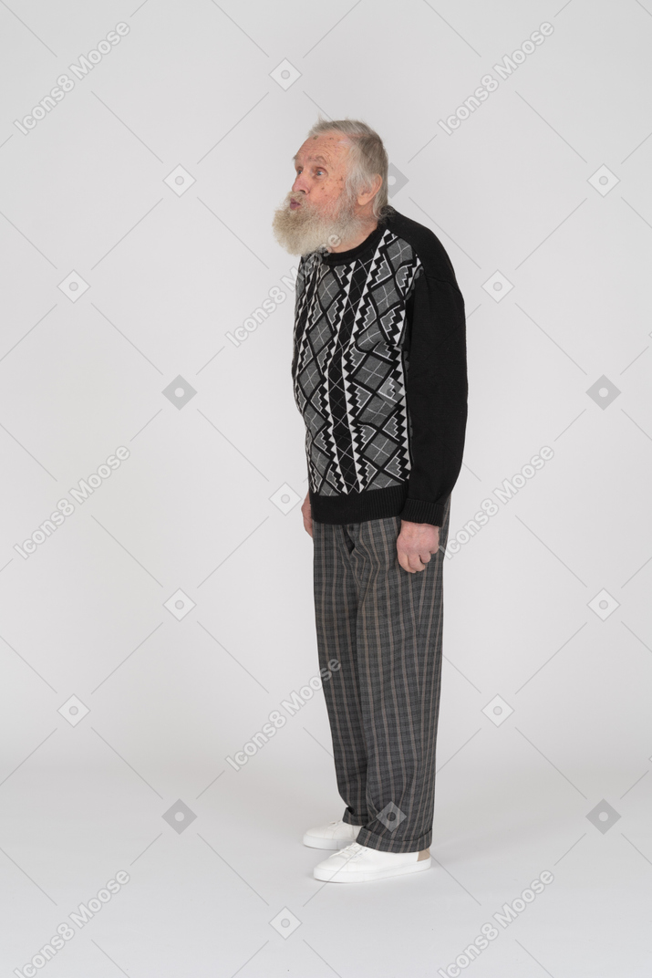 Three-quarter view of an old man standing with duck face