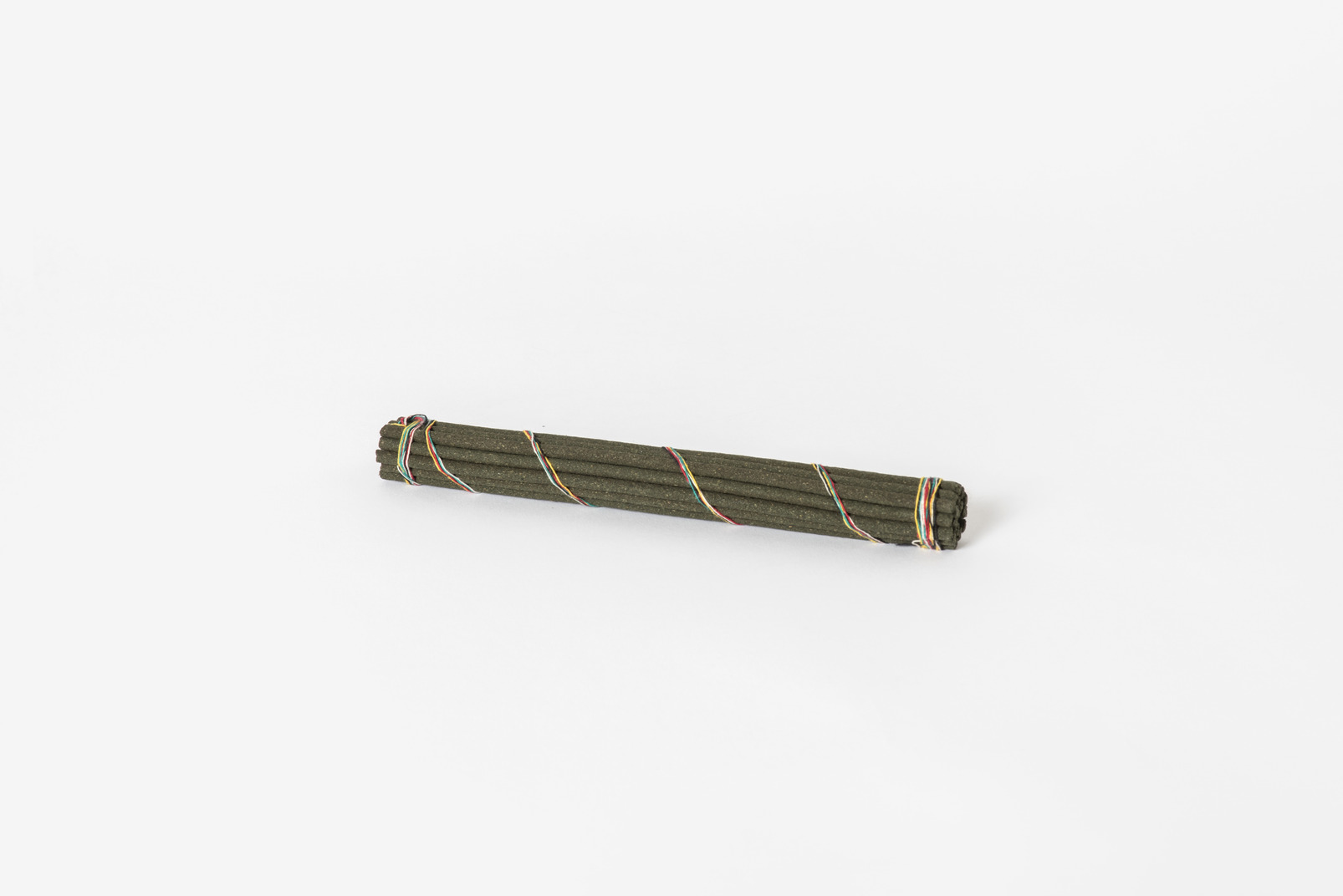 Pack of incense sticks on white background