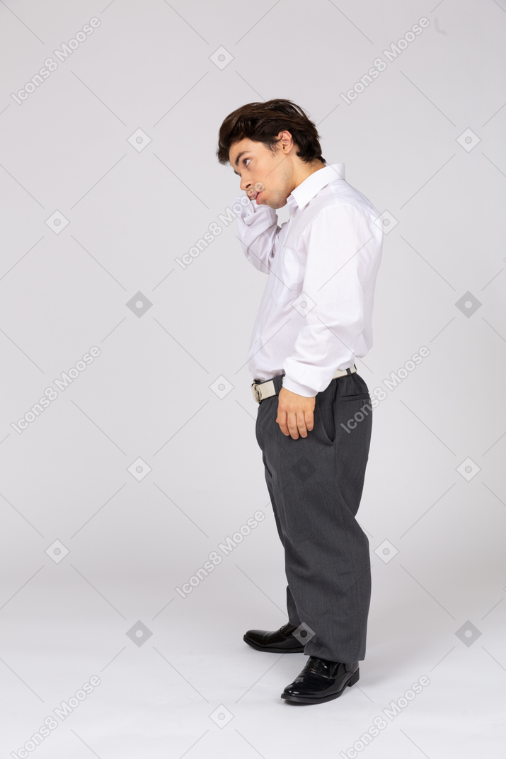 Side view of an office worker scratching his head