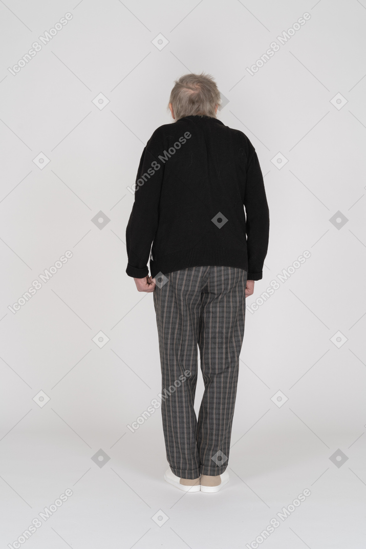 Back view of an old man shrugging
