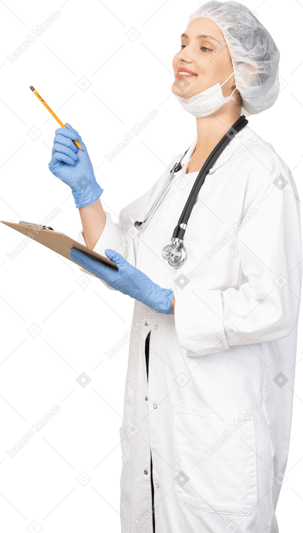 Three-quarter view of a smiling young female doctor making notes on her tablet