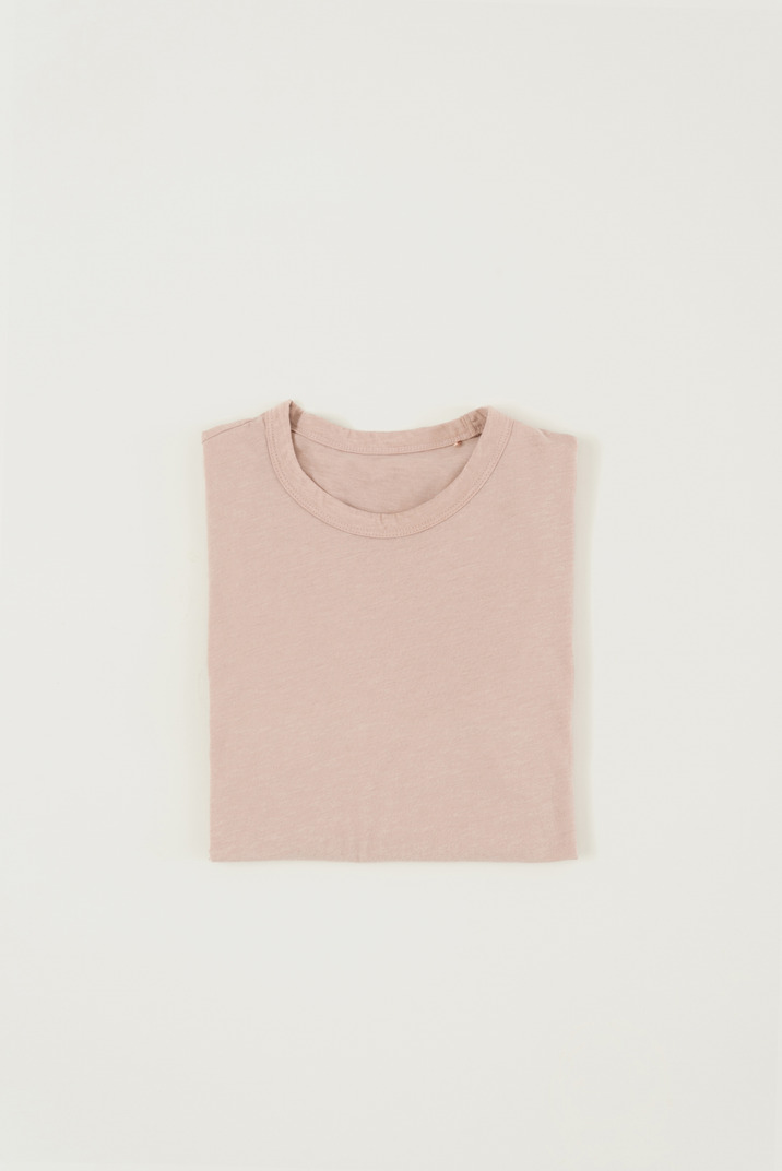 Folded greyish pink t-shirt