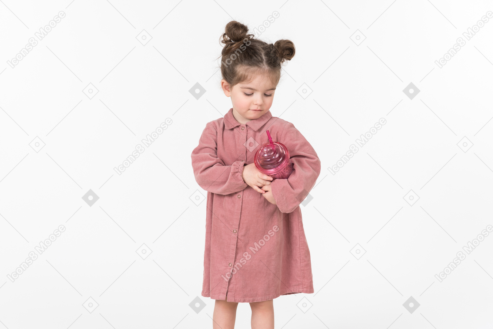Little kid girl holding pink plastic cup