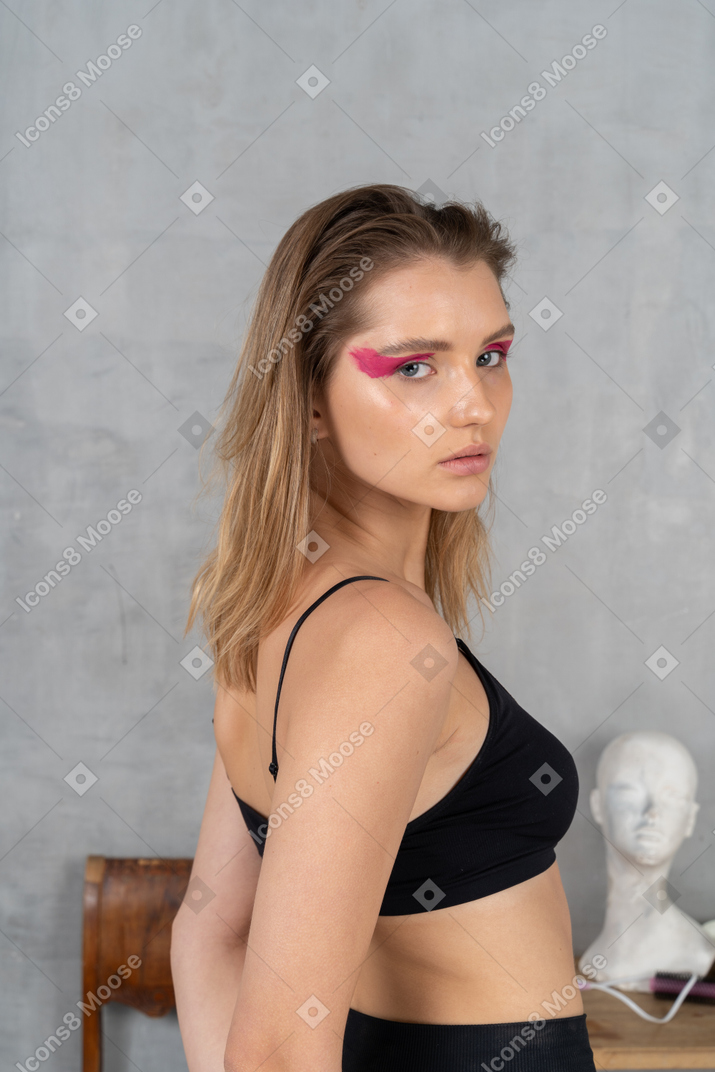 Young woman with bright pink eye make-up