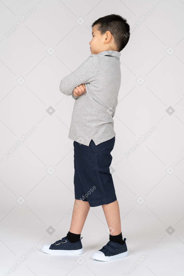 Unhappy young boy in profile