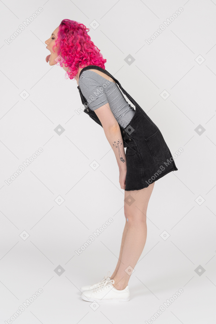 Pink haired girl showing her tongue