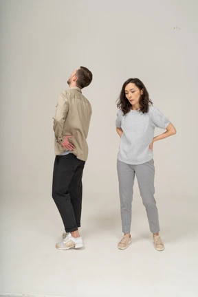 Annoyed young man and woman standing