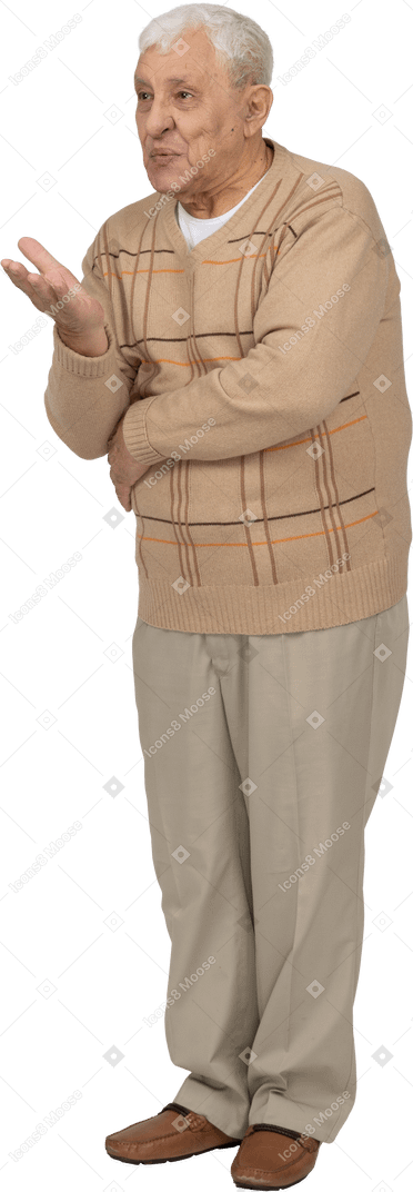 Front view of an old man in casual clothes explaining something