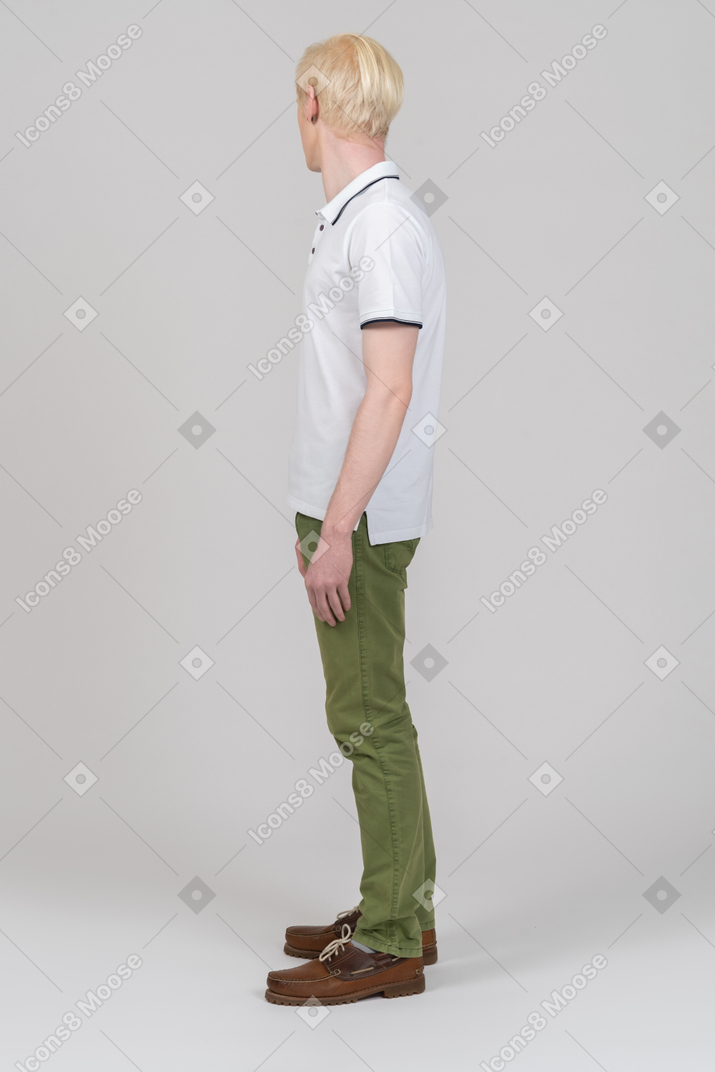 Young man standing and looking away