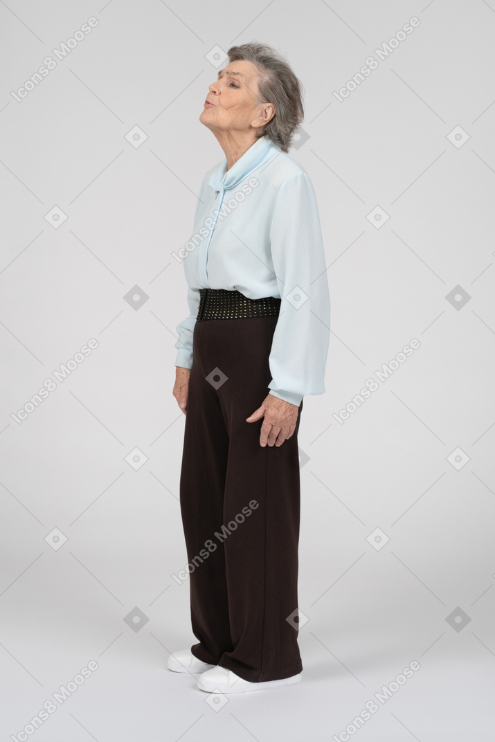 Side view of an old woman with kissy face
