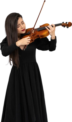 Close-up of a young emotional lady in black dress playing the violin