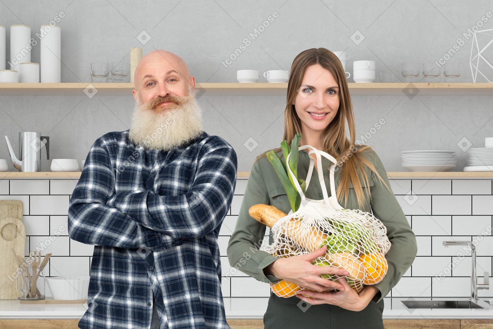 A man and a woman standing in a kitchen