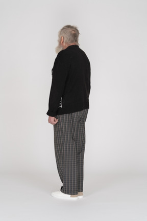 Rear view of old man standing straight