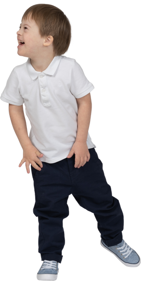 Front view of a boy smiling wide to the left