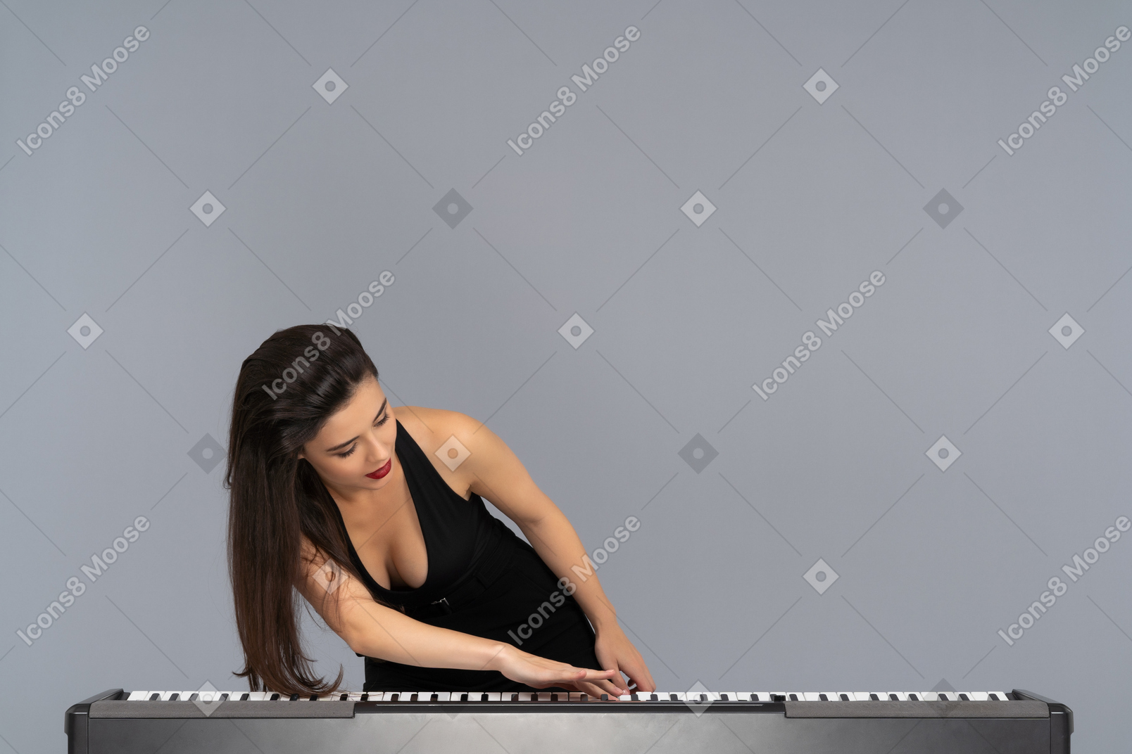 Passionate female pianist swiping piano keys