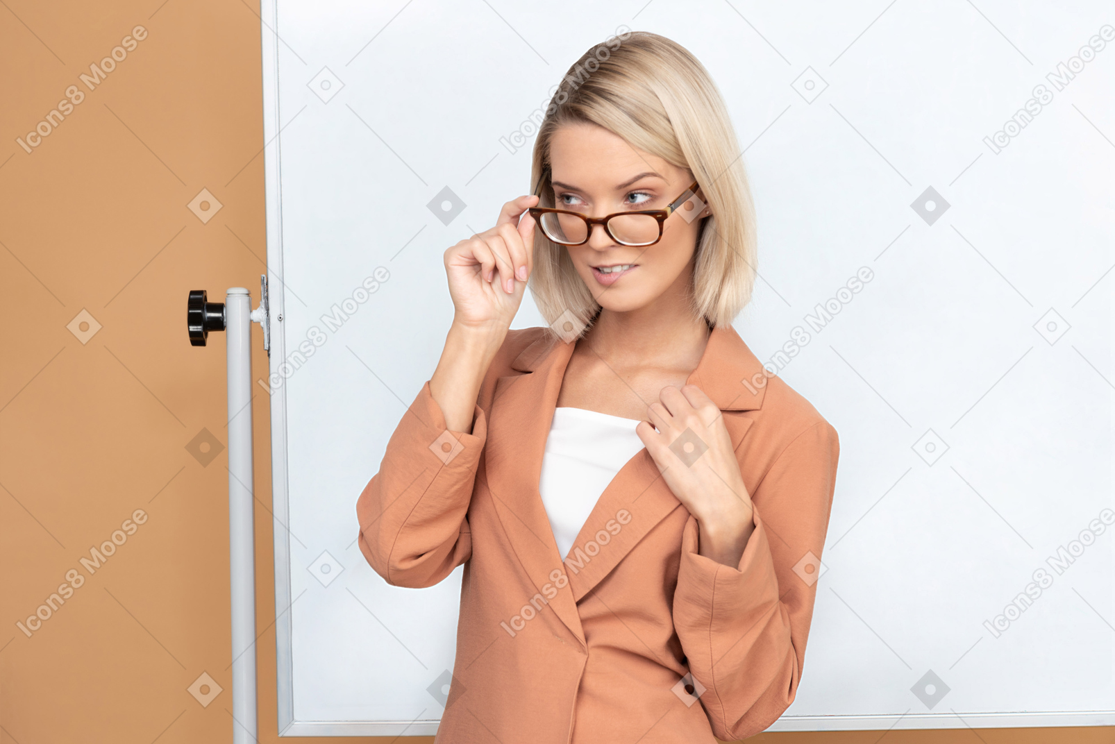 Beautiful teacher in terracotta jacket bitting her lip