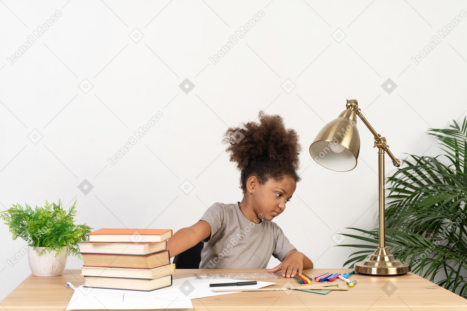 Bored little girl doing her homework while isolated