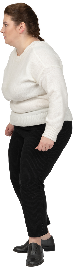 Scared plus size woman in casual clothes standing