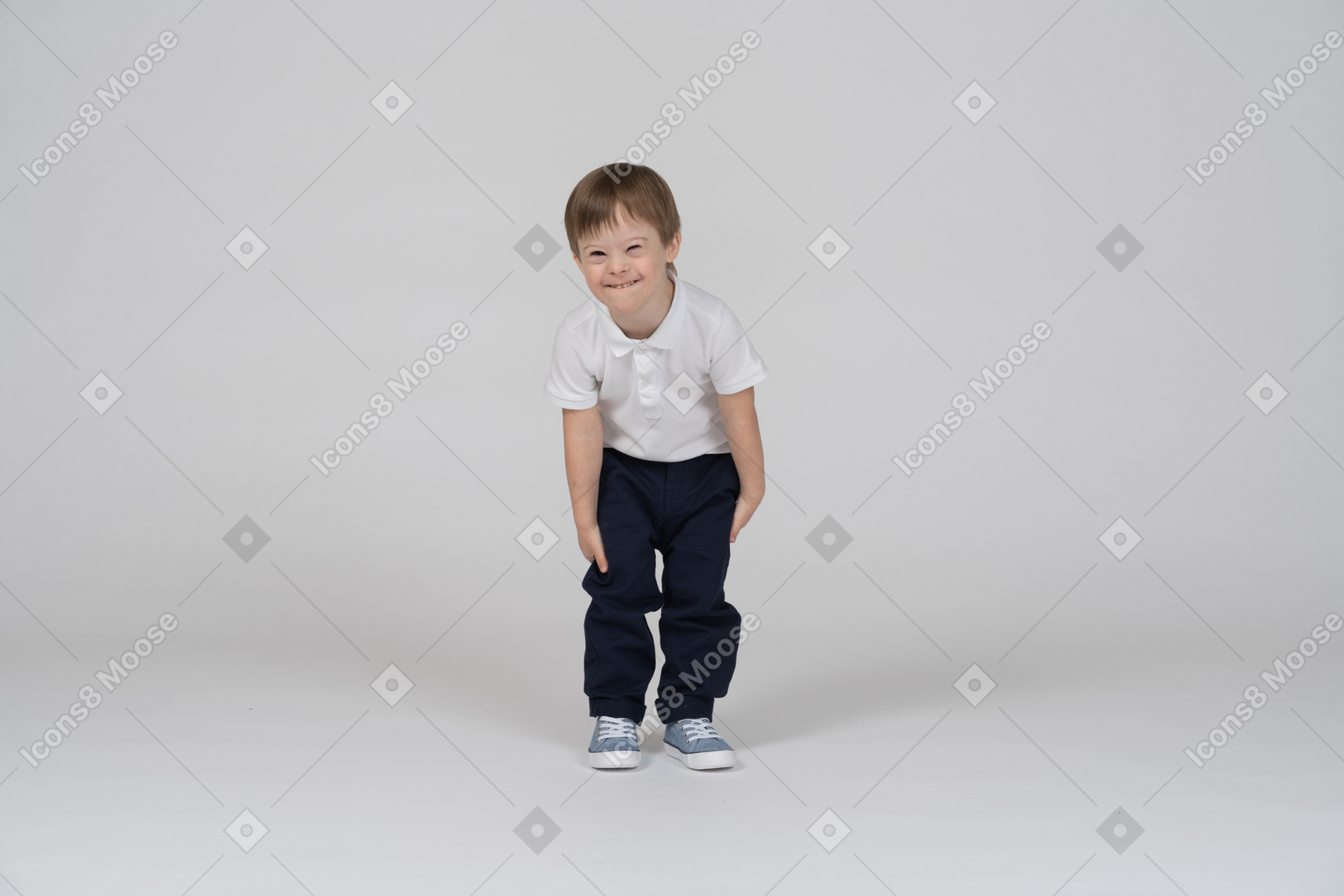 Smiling boy standing and leaning forward