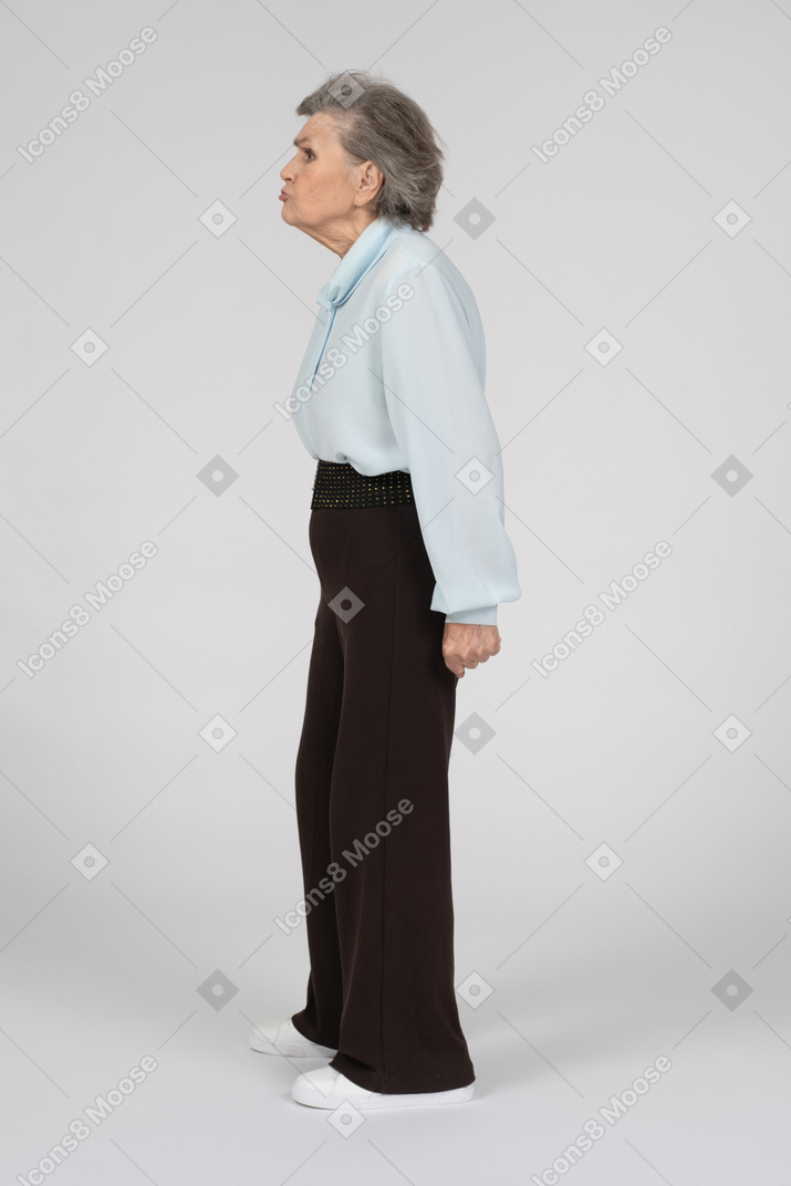 Side view of a pouting old woman